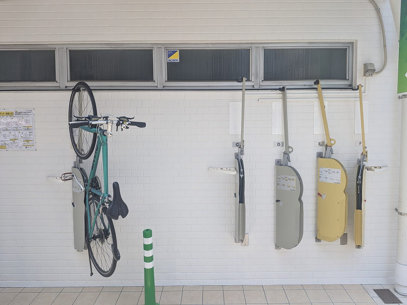Vertical bicycle racks in the parking area of a residential building in Shibuya-ku, Tokyo